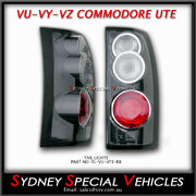 ALTEZZA TAIL LIGHTS FOR VT VX VU VY VZ COMMODORE WAGONS & UTES - BLACK